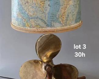 Handcrafted lamp with copper fixtures, a brass propeller, wood wheel and local map on the shade