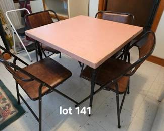 Wood card table with pink vinyl top and 4 folding chairs