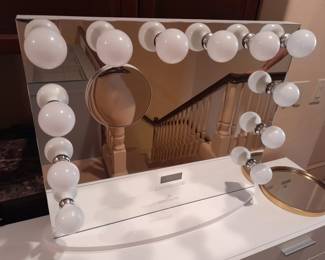 Impressions vanity mirror with Blue Tooth technology, embedded speaker system, light dimming, time and weather report functions