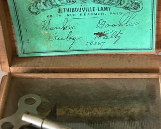 Key winds up the music box on the bottom!