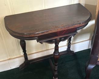 Small antique table with carved bottom and legs