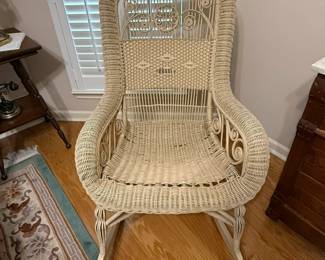 Antique wicker rocking chair. $100.
