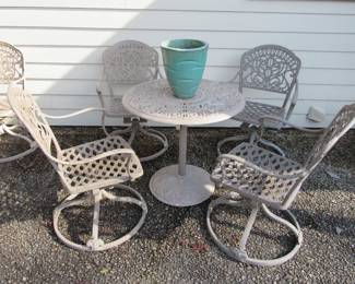 Heavy cast aluminum bistro table with 4 rocking/swivel chairs