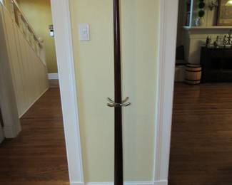 Heavy mahogany coat rack with brass hooks