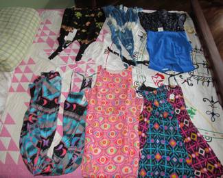 Designer clothes such as Mara Hoffman, Chloe, ALC Brec + Bridge, BCBG, Alive & Olivia, Love Shack Fancy, & Frame Denim