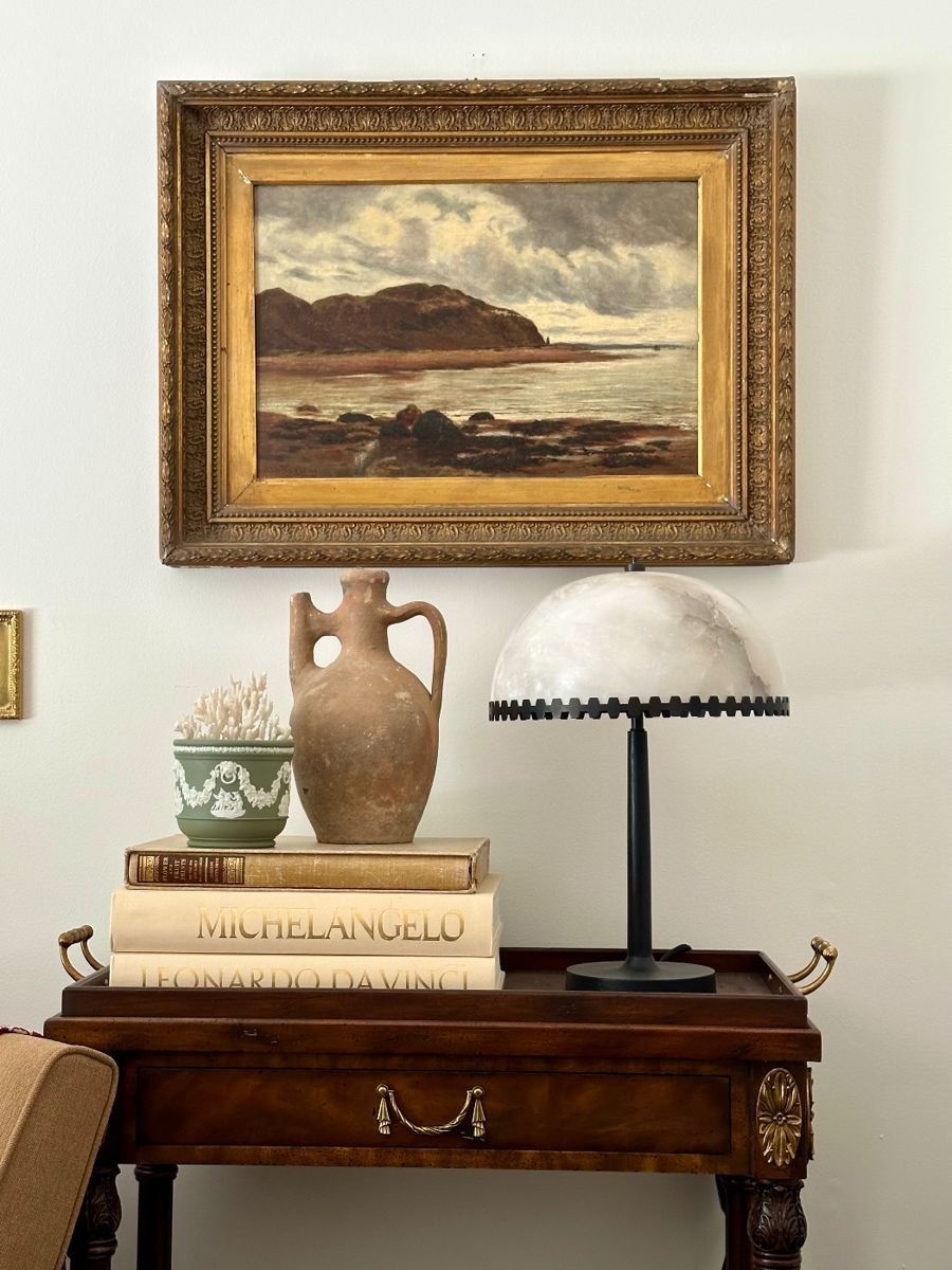 Example pieces available in sale:

1881 oil on canvas (30” x 23”) by Arthur Lee Rogers, a landscape painter from Liverpool, UK. Moved to Vancouver where he became a founding member of the Vancouver Art association in 1894. $3445. 

Greek olive oil pottery piece $295.

CB2 lamp (shade is alabaster) and is available in their current catalogue $119.

Jasperware by Wedgewood in sage green $45. 

Antique coral $99.

Art books with linen covers: $199/e.

Theodore Alexander Bar Cart with removable tray: $99 (damage to left handle; otherwise in stable condition)