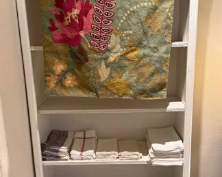 Hand-embroidered decorative textile / wall hanging.

Vintage hand embroidered linens.
Anthropologie linens