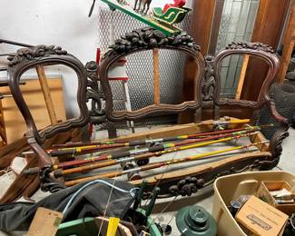 Underneath the fishing poles is a beautiful Victorian sofa frame ready to be reupholstered 