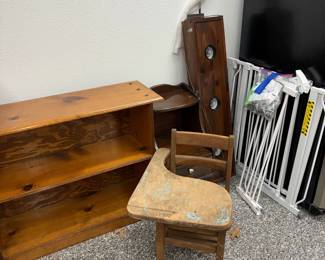 bookcase, small wood school desk, pet gates