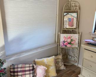 corner shelf, pillows, wall decor