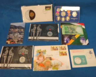 Lot 127. Eight foreign coin items including two Canadian Spirit of Anzac 50-cent coins, one 1967 Mexican peso with .0514 oz. of silver, and more.