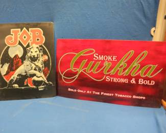 Lot 292. Two metal signs. A Gurkha Tobacco sign 32" x 18" and a Job Rolling Papers sign 24" x 18"