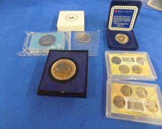 Lot 202. Collectible coins: Two 1987 Canadian bronze commemorative $1.00 coins, Two 4-nickel Westward Series nickel sets, and more.
