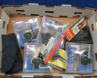Lot 394. Magazine loader, sling, gun locks, rail-mount light, and more