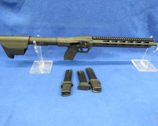Lot 14. Smith & Wesson FPC S/N: VA06157, 9mm collapsible carbine rifle with three magazines, has a threaded barrel, and folds to fit in a transport bag.