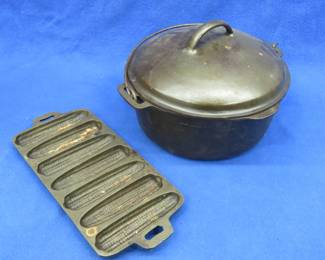 Lot 177. Cast iron Wagner Ware 5-qt Dutch oven with lid and an unmarked cast iron corn bread pan
