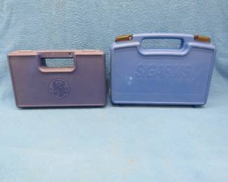 Lot 240. Two empty pistol cases. Smith & Wesson 617 and a Sig P232.