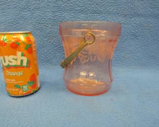 Lot 239. Pink Depression glass ice bucket with etched design and a fancy handle. Rare shape.