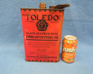 Lot 263. Vintage Toledo "Thread Cutting Oil" can that has around 1/3 of the contents remaining