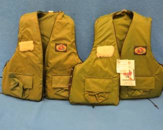 Lot 210. Two Stearns adult universal size life jackets. One with tags.