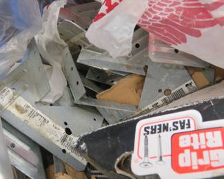 Lot 365. Framing brackets, roofing nails, and more in a plastic milk crate