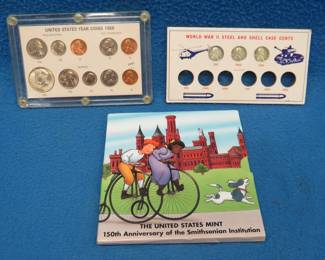 Lot 258. Three sets of collectible coins: 1996 Smithsonian 90% silver dollar. 1968 type set. Three 1943 steel pennies.