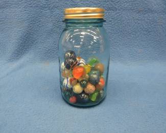 Lot 249. Marbles in a canning jar. Includes shooters and some vintage clay marbles.