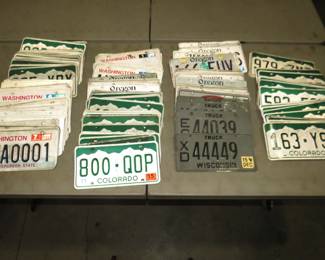 Lot 235. 30 pounds of old license plates. Most are from Colorado, Washington, and Oregon.