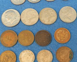 Lot 89. Collectible coins: 1896 and 1916 Canadian pennies. One Buffalo nickel. Two British Schillings. Ten U.K. New pence. And more.
