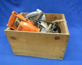 Lot 179. An old Black & Decker 7 1/4" circular saw and an unmarked heavy-duty looking drill in a wooden crate with an extra blade