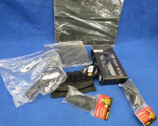 Lot 391. Magazine pouches, 12-gauge bore cleaners, gun lights, and more