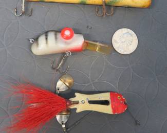 Lot 55. Doug Parker Rabble Rouser, Pflueger ZAM feathered bucktail, and an unidentified stick bait