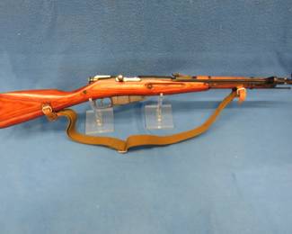 Lot 111. M91 Mosin-Nagant carbine with matching numbers. S/N PA6003. Includes folding spike bayonet, sling, and a case.