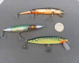 Lot 51. Heddon Dying Quiver, FLT Garison Pencil bait, and an unidentified stick bait