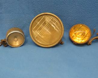Lot 172. Three antique auto lights including a Ford. Untested.