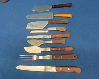 Lot 243. Nine advertising serving utensils and knives from South Dakota