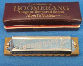 Lot 151. Antique miniature Boomerang 10-hole harmonica in the key of D. Sounds great. Excellent condition.