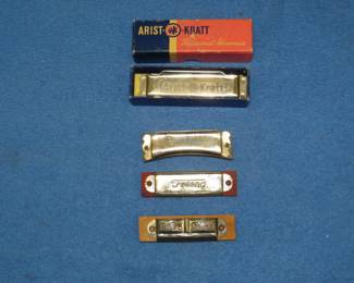 Lot 274. Four harmonicas: Arist-O-Krat 10-hole diatonic harmonica. Club Piccolo "Stabila" diatonic harmonica. Friend 6-hole harmonica. Pope Band harmonica.