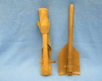 Lot 144. Entrenching shovel and an adz marked "US"