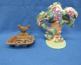 Lot 37. Two cast-iron items. A footed soap dish and a door stop.