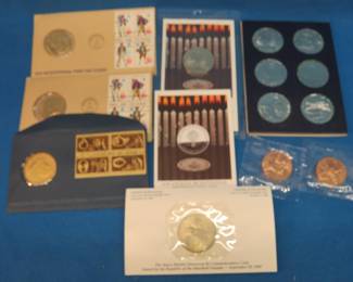Lot 124. Collectible coins and medallions: $5 Marshall Islands cupro-nickel coin, Two First Spouse bronze medals, Three First Day Covers and medallions, & more