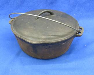 Lot 181. Cast iron Dutch oven marked Made In USA, with a lid