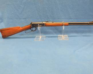 Lot 175. Winchester Model 94 .32 WS lever-action rifle. S/N 1118737. Includes 27 rounds and a case.