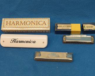 Lot 152. Three harmonicas: Unknown maker Hill Billy Band harmonica. Plastic harmonica with the box. Johan Schunk National Song harmonica. Sounds great.