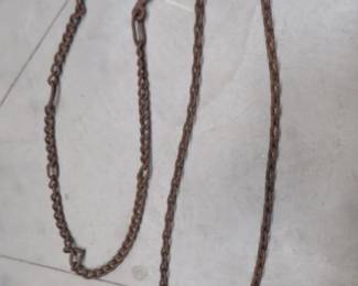 Lot 103. 8' of 1/4" chain and 6' of 3/8" chain with hooks on both ends
