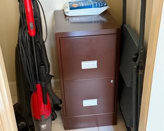 Filing cabinet, step stool, vacuum