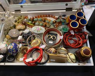 Fun case of unique smalls- Cinnabar jewelry, trouble perfume, stone jewelry…