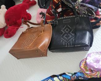 Wrangler Tote Bags by Montana West – CCW Design
Wrangler brand studded tote handbags made by Montana West. Faux leather construction with western-style stud detailing, braided handles, contrast stitching, and metal feet on the bottom. Includes a concealed carry pocket (CCW design) with interior access. Structured medium-to-large size, suitable for everyday or casual use. Normal wear consistent with use. Sold individually.