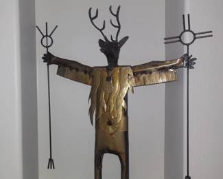 Hand crafted metal folk-art sculpture depictin g a deer figure, inspired by southwestern and Yaqui-style cerimonial imagery. Welded metal construction with patinated brass and bronze-toned elements.