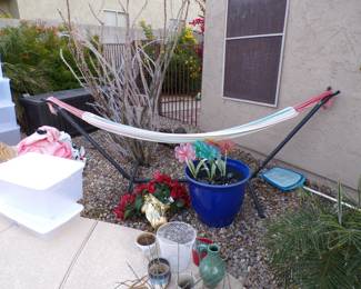 Free standing hammock. Various pots and vases. Plastic storage totes. Various inflatable pool toys.